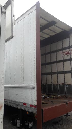 SKENDER,INC PARKING LOT, ROAD SERVICE TRUCK AND TRAILER